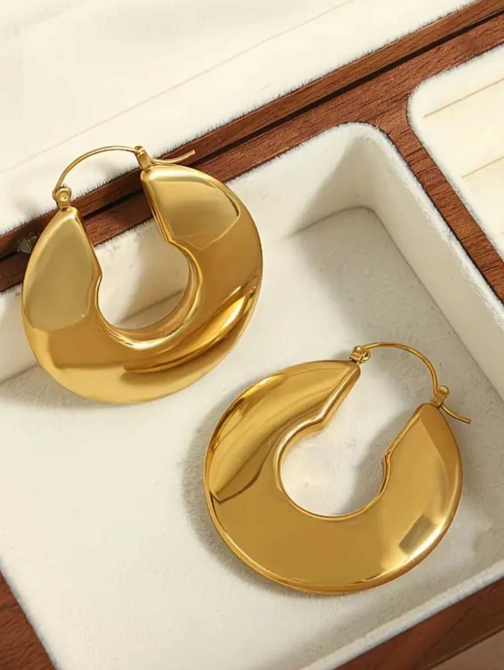Chucky gold hoop earrings; 1.57